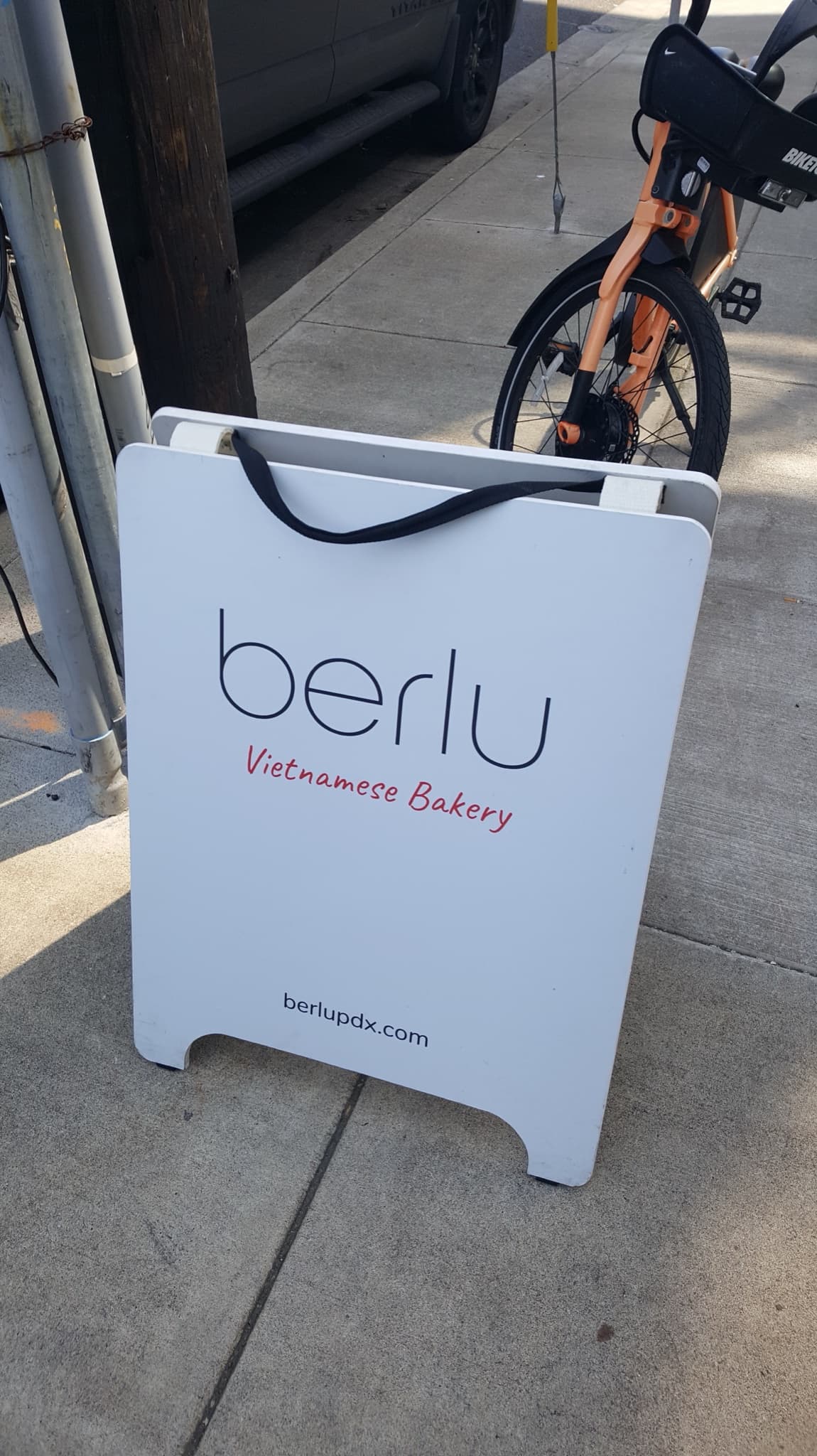Berlu, Portland: A-frame sign reading berlu Vietnamese Bakery on the pavement outside